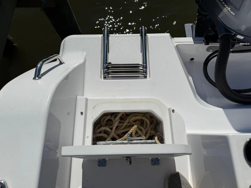 Slide: The Image of 2024 Sportsman Heritage 231 Center Console with rope storage and ladder. - 5