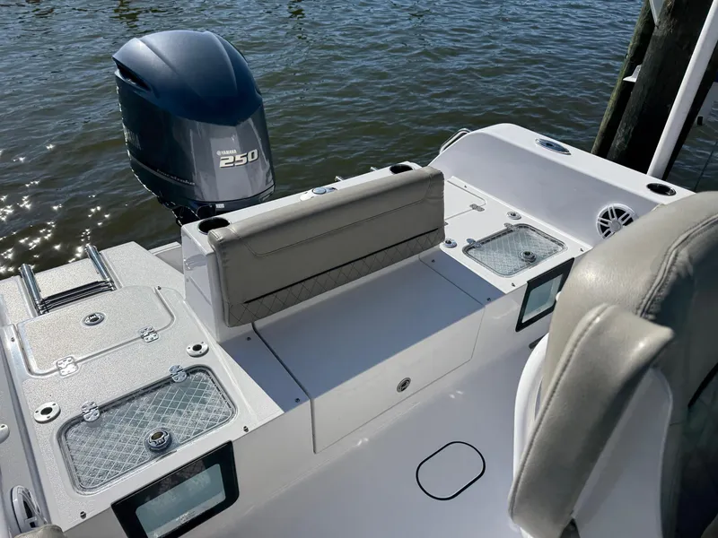 Slide: The Image of 2024 Sportsman Heritage 231 Center Console boat with Yamaha 250 engine on water. - 7