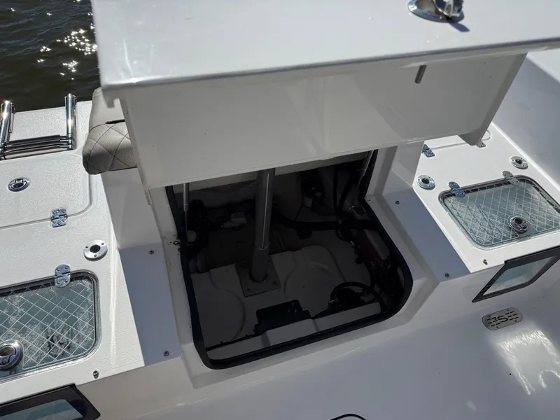Slide: The Image of 2024 Sportsman Heritage 231 Center Console boat interior with open storage compartment. - 8