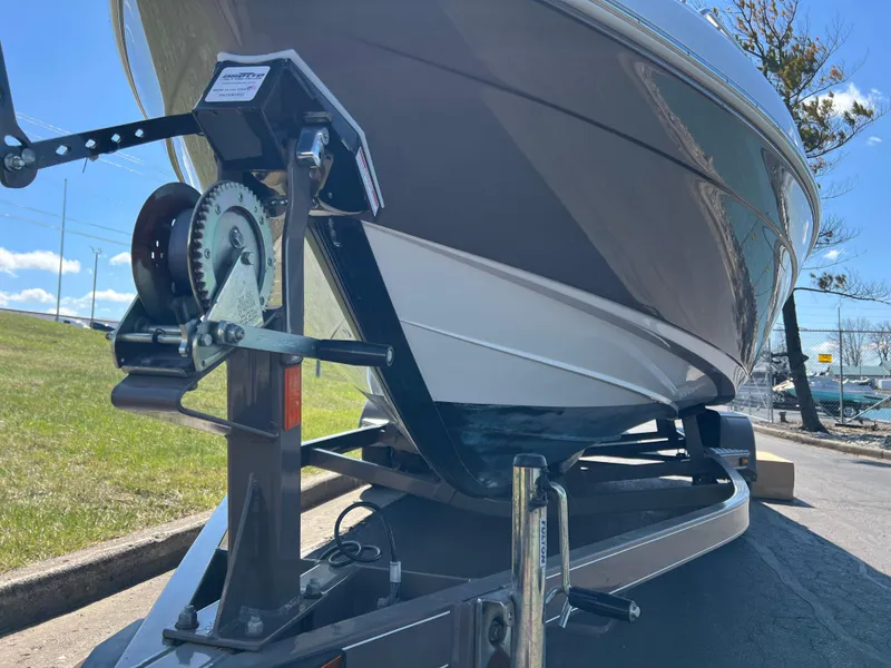 Slide: The Image of 2008 Yamaha Boats 232 Limited on trailer, close-up view of hull and winch. - 10