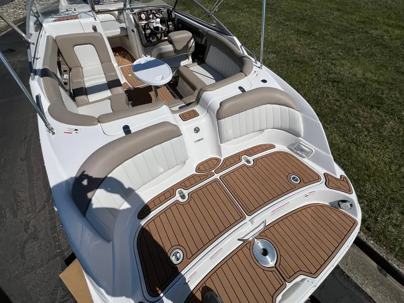 Slide: The Image of 2008 Yamaha Boats 232 Limited interior with seating and table, featuring elegant wood accents. - 11