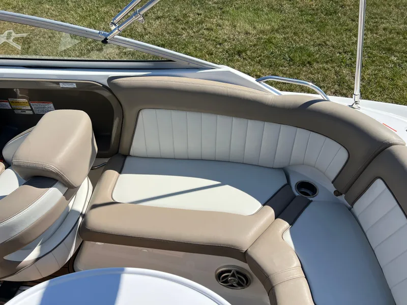 Slide: The Image of 2008 Yamaha Boats 232 Limited interior seating with beige and white upholstery. - 14