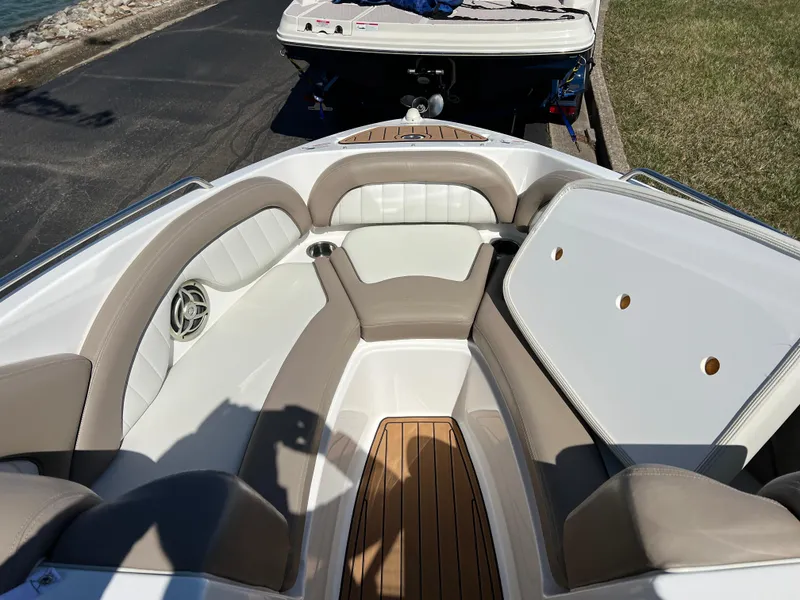 Slide: The Image of 2008 Yamaha Boats 232 Limited interior with beige seating and wood accents. - 19