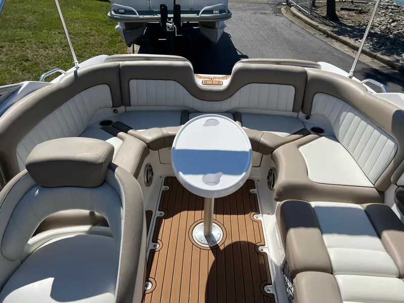 Slide: The Image of 2008 Yamaha Boats 232 Limited interior with cushioned seating and a central table. - 22