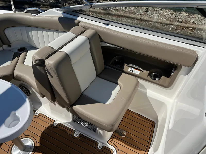Slide: The Image of 2008 Yamaha Boats 232 Limited interior with beige and white seating, wood-style flooring. - 23