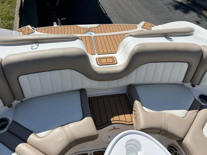 Slide: The Image of 2008 Yamaha Boats 232 Limited interior with beige and white seating, wood accents. - 26