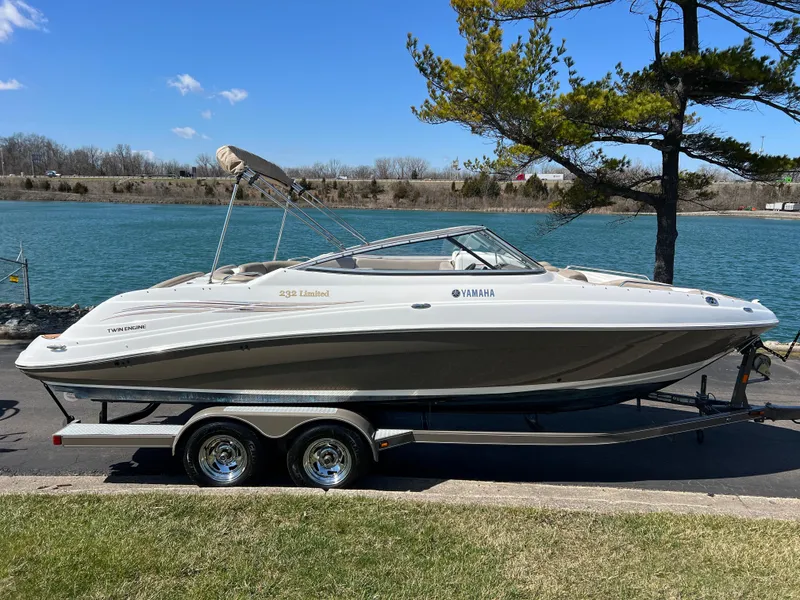 Slide: The Image of 2008 Yamaha Boats 232 Limited on trailer by a scenic waterfront. - 3