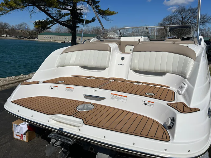 Slide: The Image of 2008 Yamaha Boats 232 Limited with teak-style swim platform by a lake. - 6
