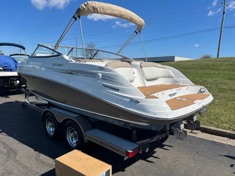 Slide: The Image of 2008 Yamaha Boats 232 Limited on trailer, featuring sleek design and spacious seating. - 7