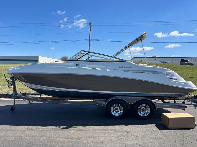 Slide: The Image of 2008 Yamaha Boats 232 Limited on trailer under clear blue sky. - 8