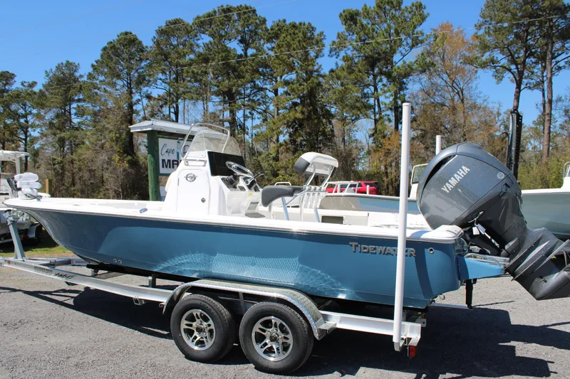 Slide: The Image of 2025 Tidewater 2110 Bay Max boat on trailer, featuring Yamaha outboard motor. - 2