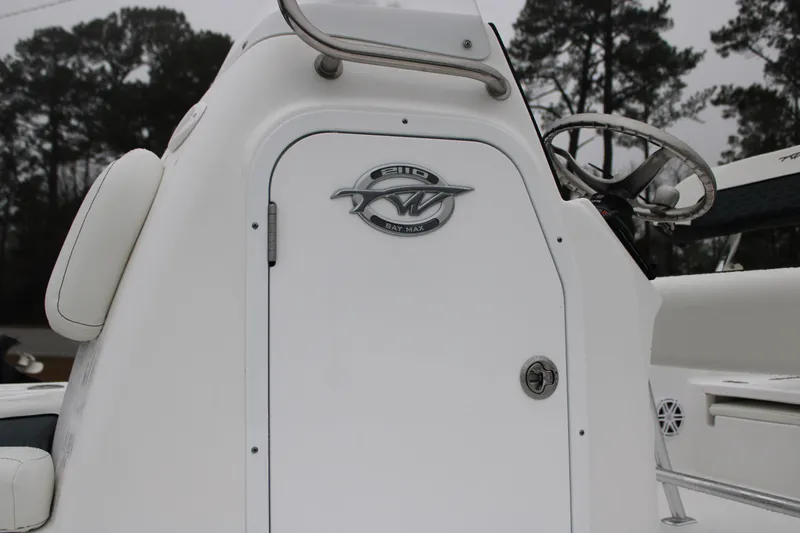 Slide: The Image of 2025 Tidewater 2110 Bay Max boat console with steering wheel and logo. - 21