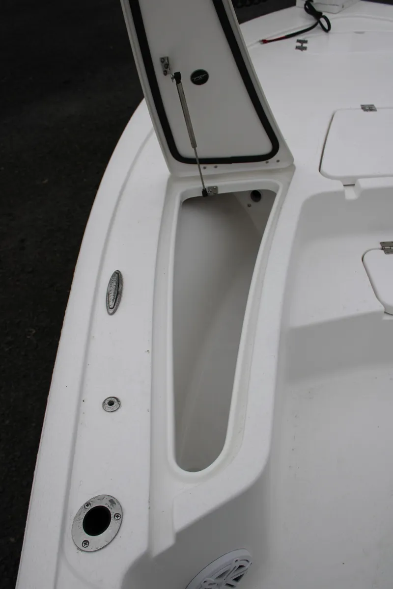 Slide: The Image of 2025 Tidewater 2110 Bay Max boat with open storage compartment on deck. - 22