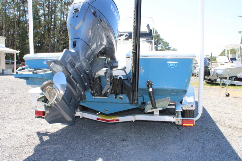 Slide: The Image of 2025 Tidewater 2110 Bay Max boat with outboard motor on trailer, rear view. - 5