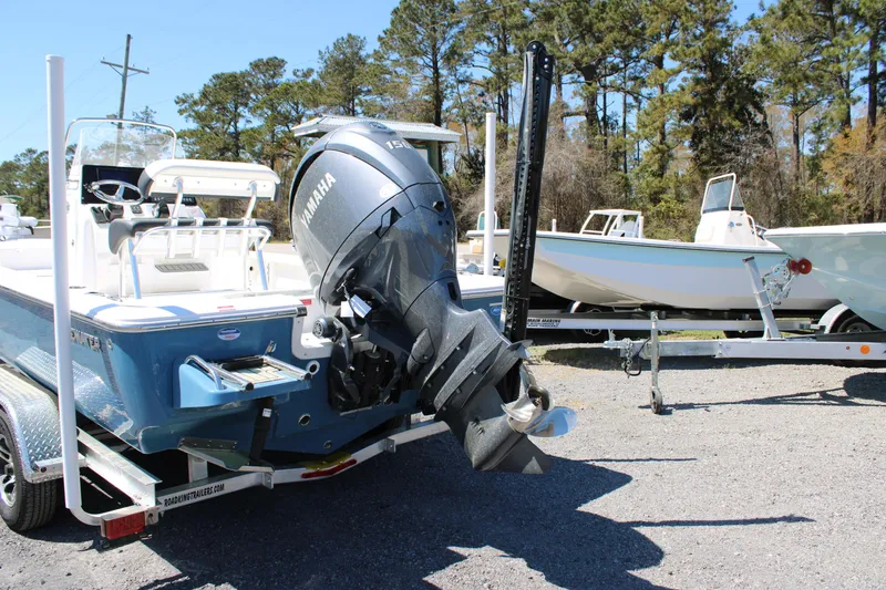 Slide: The Image of 2025 Tidewater 2110 Bay Max boat with Yamaha outboard motor on a trailer. - 6
