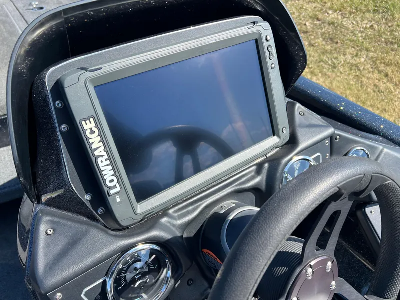 Slide: The Image of Lowrance fishfinder on 2018 Skeeter ZX 225 boat dashboard, featuring steering wheel and gauges. - 15