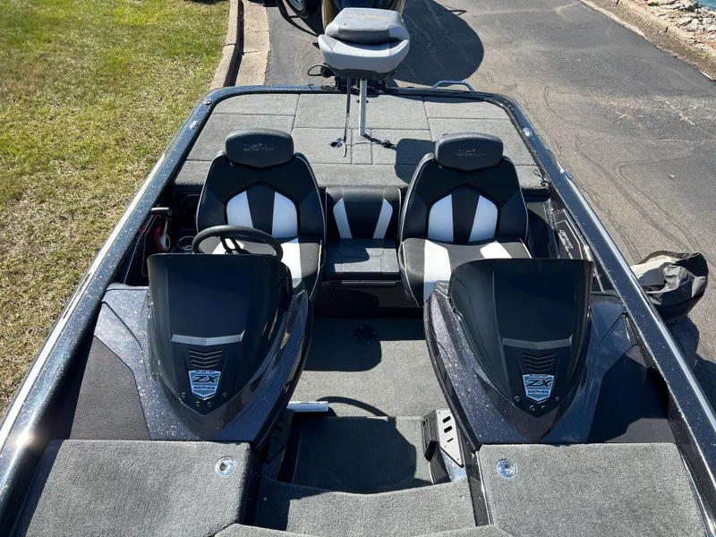 Slide: The Image of 2018 Skeeter ZX 225 boat interior with dual seats and steering wheel. - 23