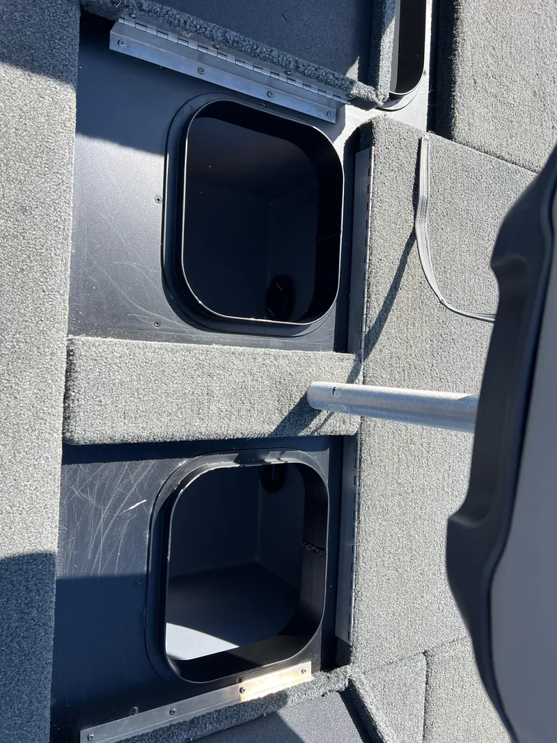 Slide: The Image of 2018 Skeeter ZX 225 boat storage compartments with open hatches. - 27