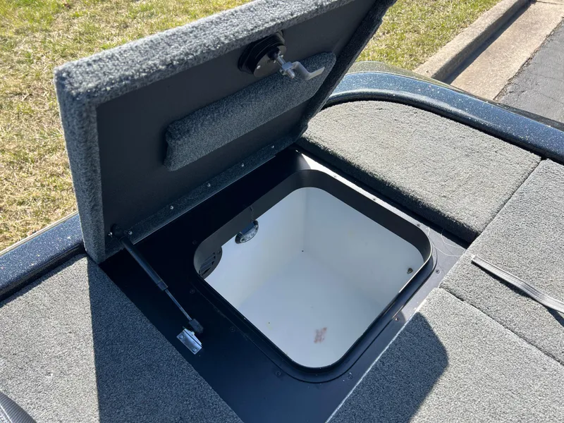 Slide: The Image of Open storage compartment on 2018 Skeeter ZX 225 boat, showing interior details. - 29