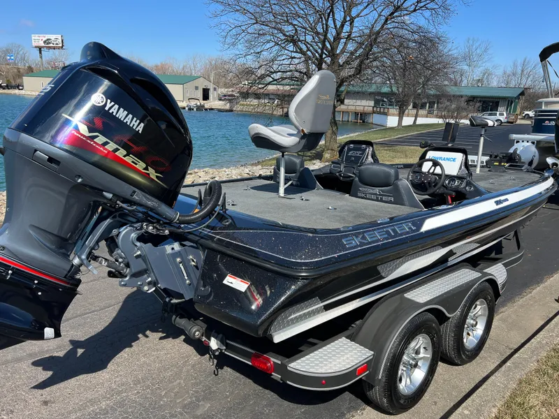 Slide: The Image of 2018 Skeeter ZX 225 boat with Yamaha engine, parked by a lakeside. - 6