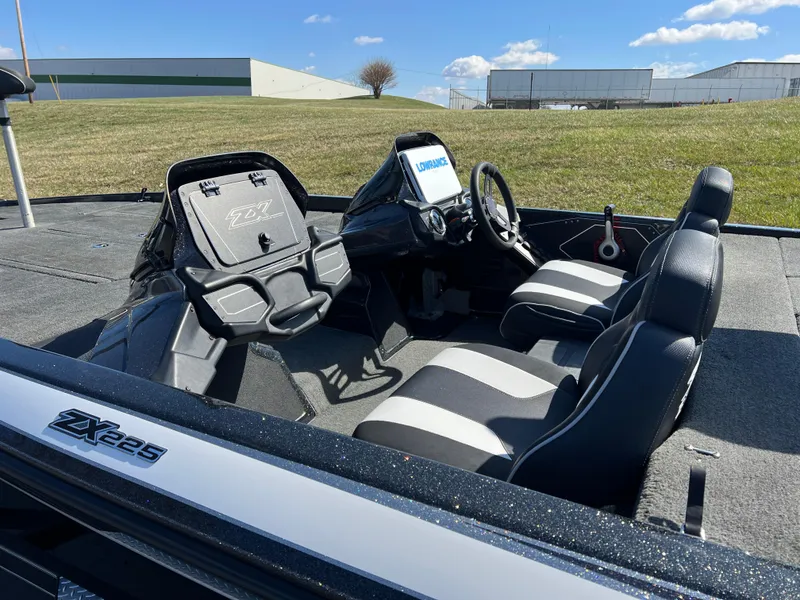Slide: The Image of 2018 Skeeter ZX 225 boat interior with steering console and seating. - 9