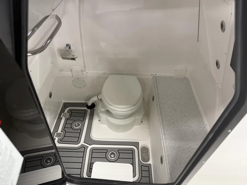 Slide: The Image of 2025 Tidewater 3100 Carolina Bay boat interior bathroom with modern fixtures and flooring. - 17