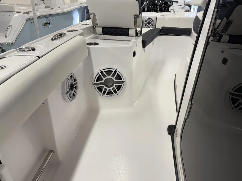 Slide: The Image of 2025 Tidewater 3100 Carolina Bay boat interior with speakers and seating. - 28