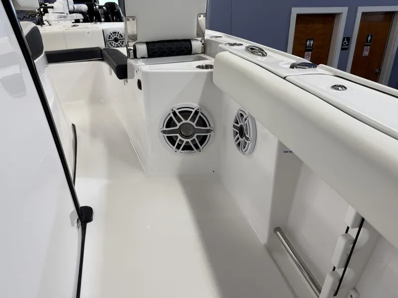 Slide: The Image of 2025 Tidewater 3100 Carolina Bay boat interior with speakers and seating. - 29