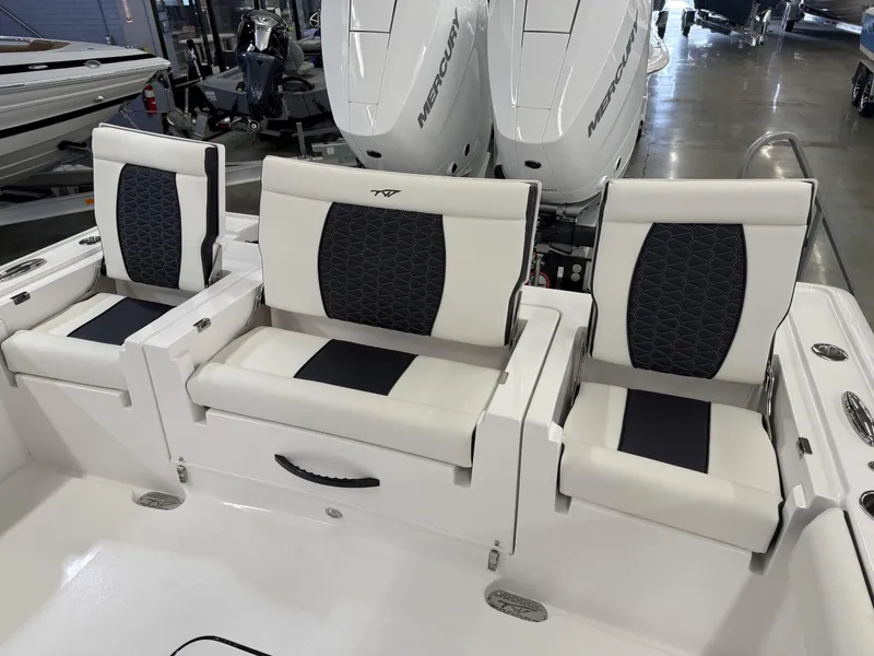 Slide: The Image of 2025 Tidewater 3100 Carolina Bay boat seats with stylish black and white design. - 6
