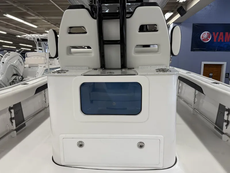 Slide: The Image of 2025 Tidewater 3100 Carolina Bay boat interior with seating and storage compartments. - 8