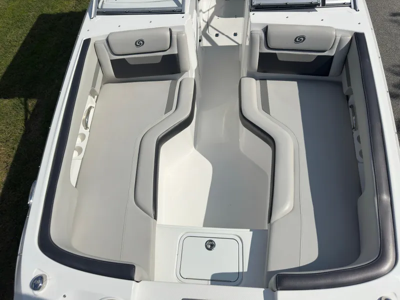 Slide: The Image of 2022 Hurricane SunDeck 235 OB boat interior with spacious seating and sleek design. - 19