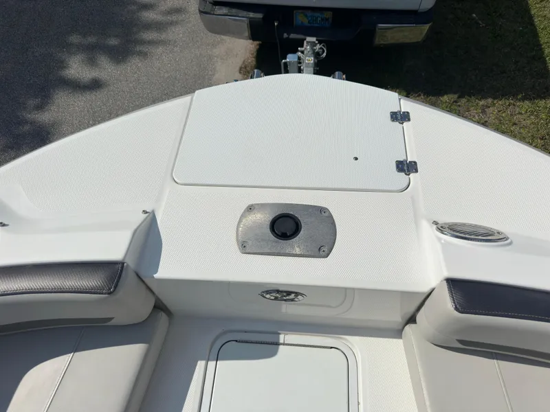 Slide: The Image of 2022 Hurricane SunDeck 235 OB boat deck with seating and storage compartments. - 20