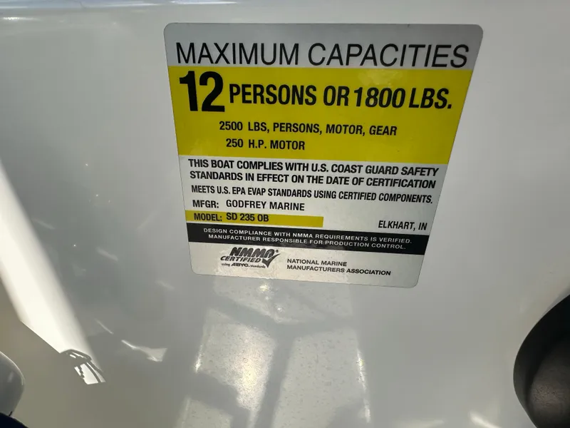 Slide: The Image of Capacity label for 2022 Hurricane SunDeck 235 OB, 12 persons or 1800 lbs, 250 HP motor. - 24