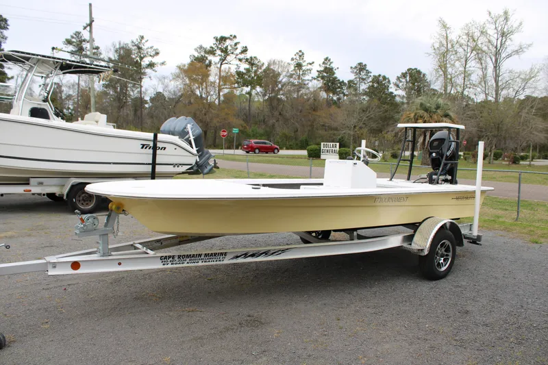 Slide: The Image of 2025 Mitzi Skiffs 17 Tournament boat on trailer, parked outdoors. - 0
