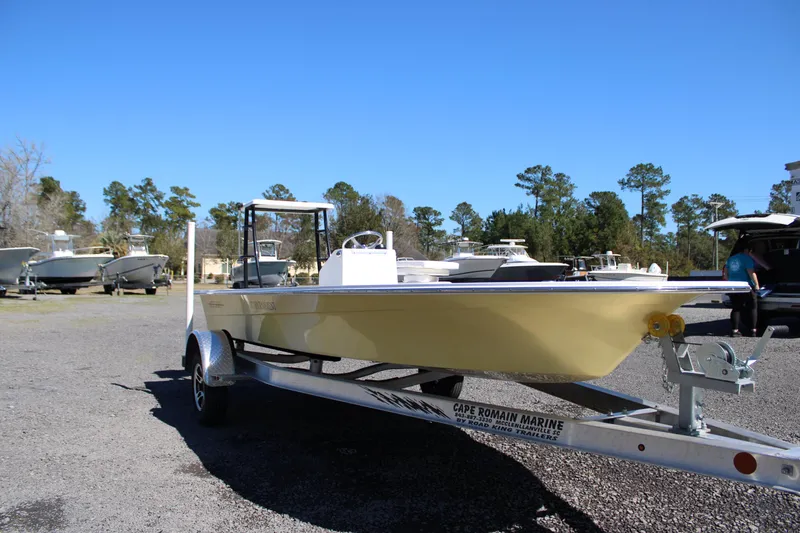 Slide: The Image of 2025 Mitzi Skiffs 17 Tournament boat on trailer in outdoor setting. - 10