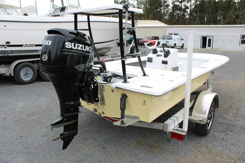 Slide: The Image of 2025 Mitzi Skiffs 17 Tournament boat with Suzuki 60 engine on trailer. - 13