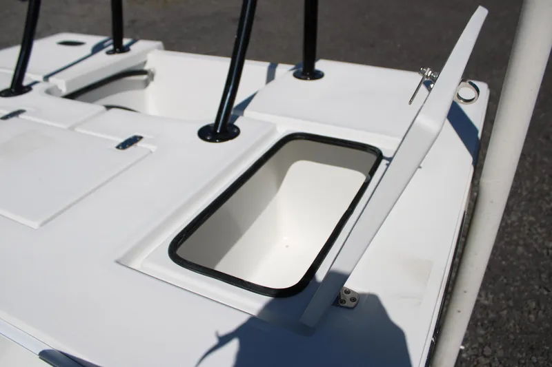 Slide: The Image of 2025 Mitzi Skiffs 17 Tournament boat deck with open storage compartment. - 21