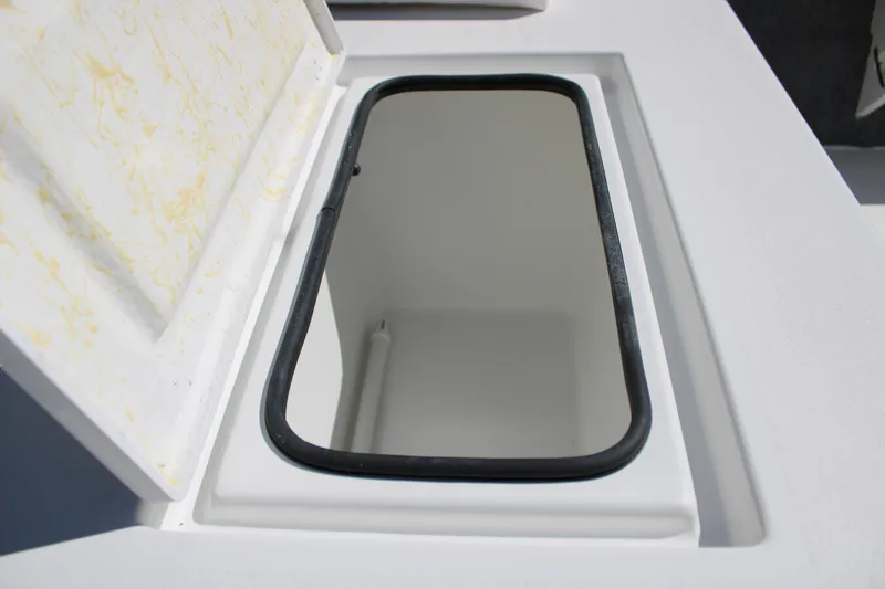 Slide: The Image of Open storage compartment on 2025 Mitzi Skiffs 17 Tournament boat. - 22