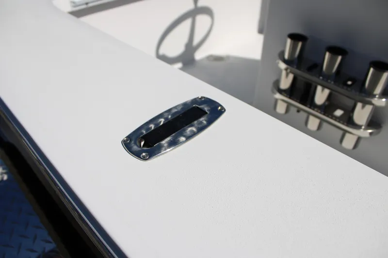 Slide: The Image of 2025 Mitzi Skiffs 17 Tournament boat detail with rod holders and steering wheel. - 24