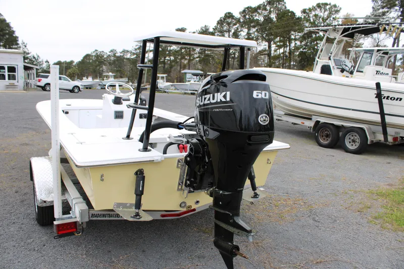 Slide: The Image of 2025 Mitzi Skiffs 17 Tournament boat with Suzuki 60 outboard motor on trailer. - 5