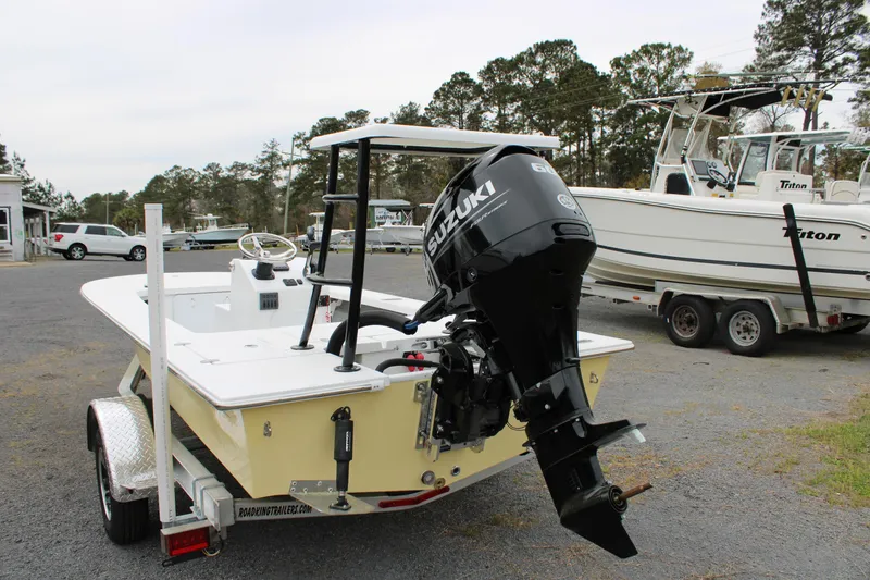 Slide: The Image of 2025 Mitzi Skiffs 17 Tournament boat with Suzuki outboard motor on trailer. - 6