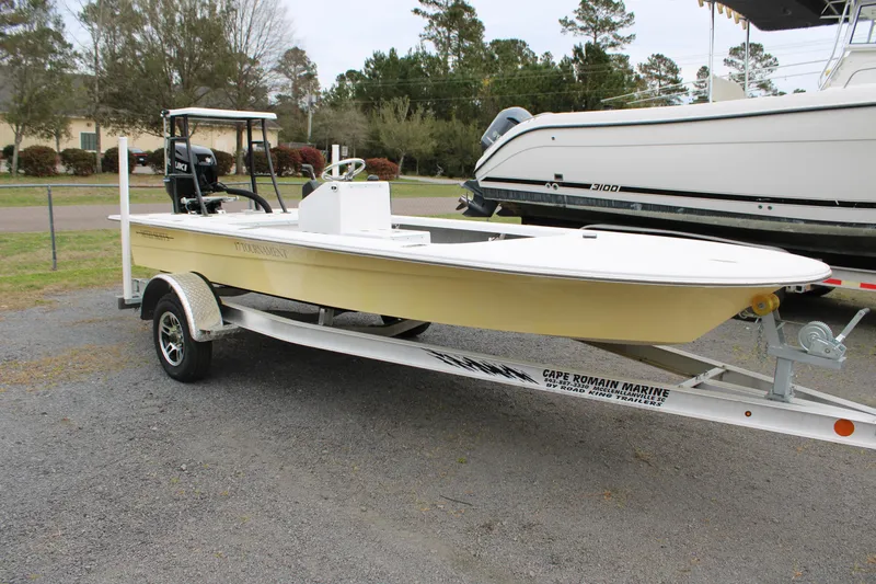 Slide: The Image of 2025 Mitzi Skiffs 17 Tournament boat on trailer, parked outdoors. - 7