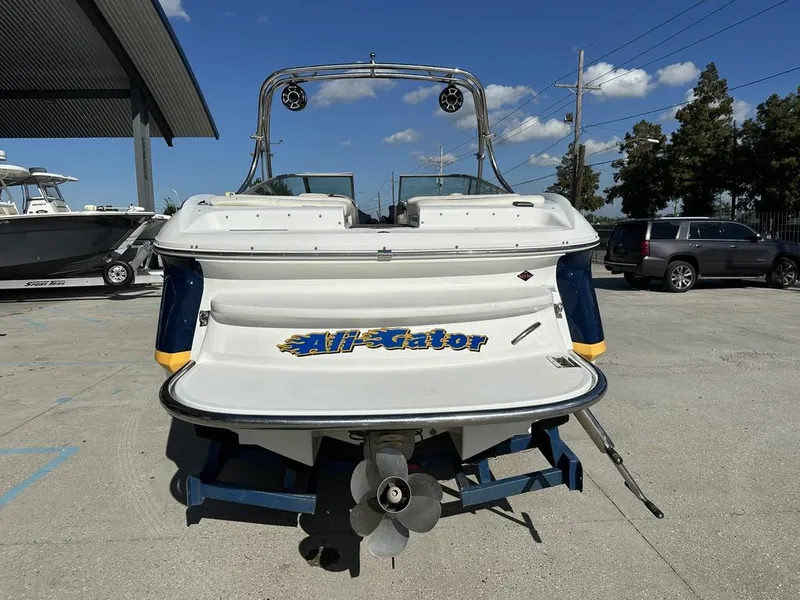 Slide: The Image of 2006 Cobalt 250 boat on trailer, rear view with "All-Gator" text. - 6