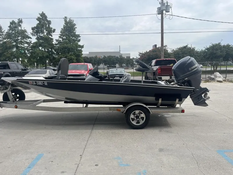 Slide: The Image of 2012 Xpress Xclusive Series X17 boat on trailer, parked outdoors. - 10