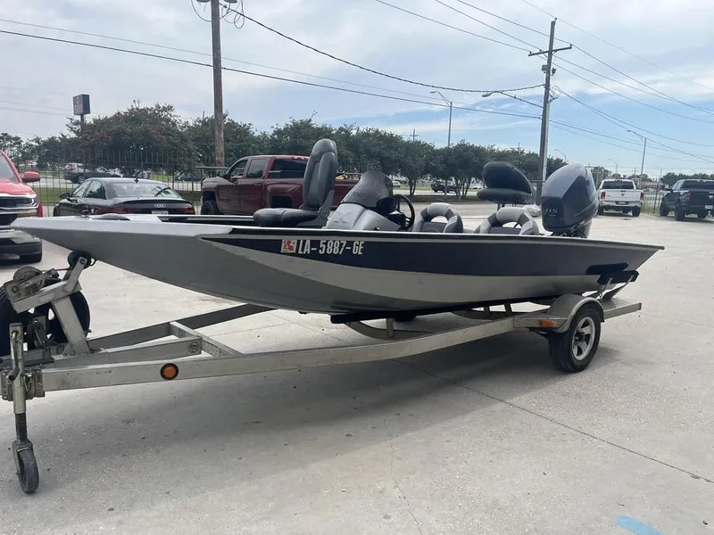 Slide: The Image of 2012 Xpress Xclusive Series X17 boat on trailer in parking lot. - 5
