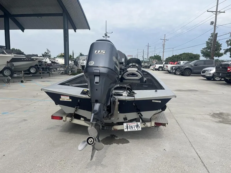 Slide: The Image of 2012 Xpress Xclusive Series X17 boat with 115 horsepower engine in a parking lot. - 8