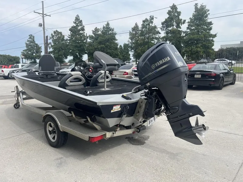 Slide: The Image of 2012 Xpress Xclusive Series X17 boat with Yamaha outboard motor on trailer. - 9