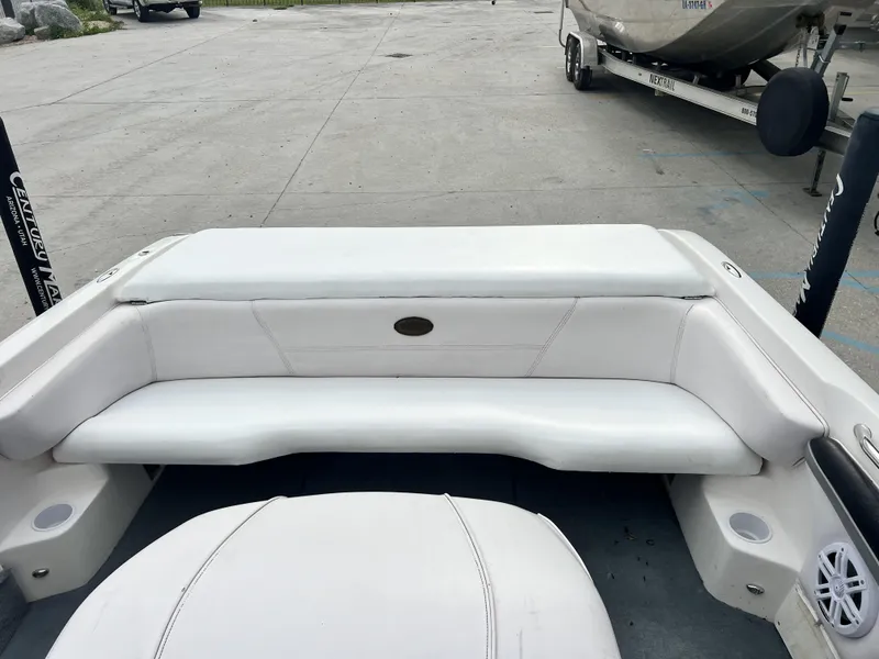 Slide: The Image of 2003 Supra Launch LTS boat interior with white seating and cup holders. - 5