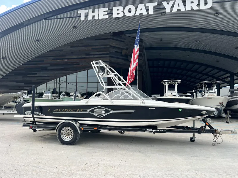Slide: The Image of 2003 Supra Launch LTS boat on trailer at The Boat Yard. - 6