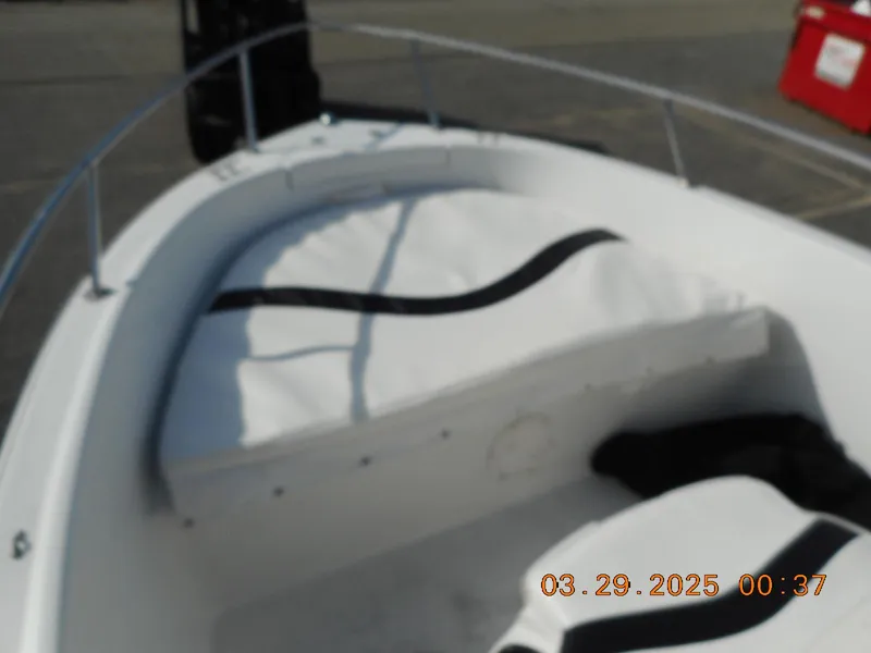 Slide: The Image of 2002 Seaswirl Striper 1851 Center Console boat interior with white seating. - 5